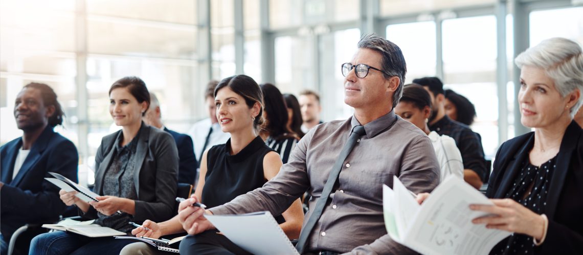 Shot of a group of businesspeople attending a conference